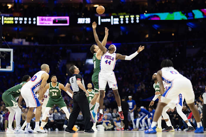 Philadelphia 76ers forward Paul Reed (44) and Milwaukee Bucks center Brook Lopez (11) tip off 